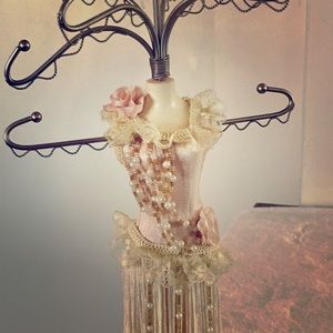 Mannequin standing jewelry holder.